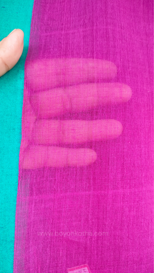 Magenta handwoven mul cotton saree with rama green border, pallu ending in tassels. Plain handloom saree from Bengal.