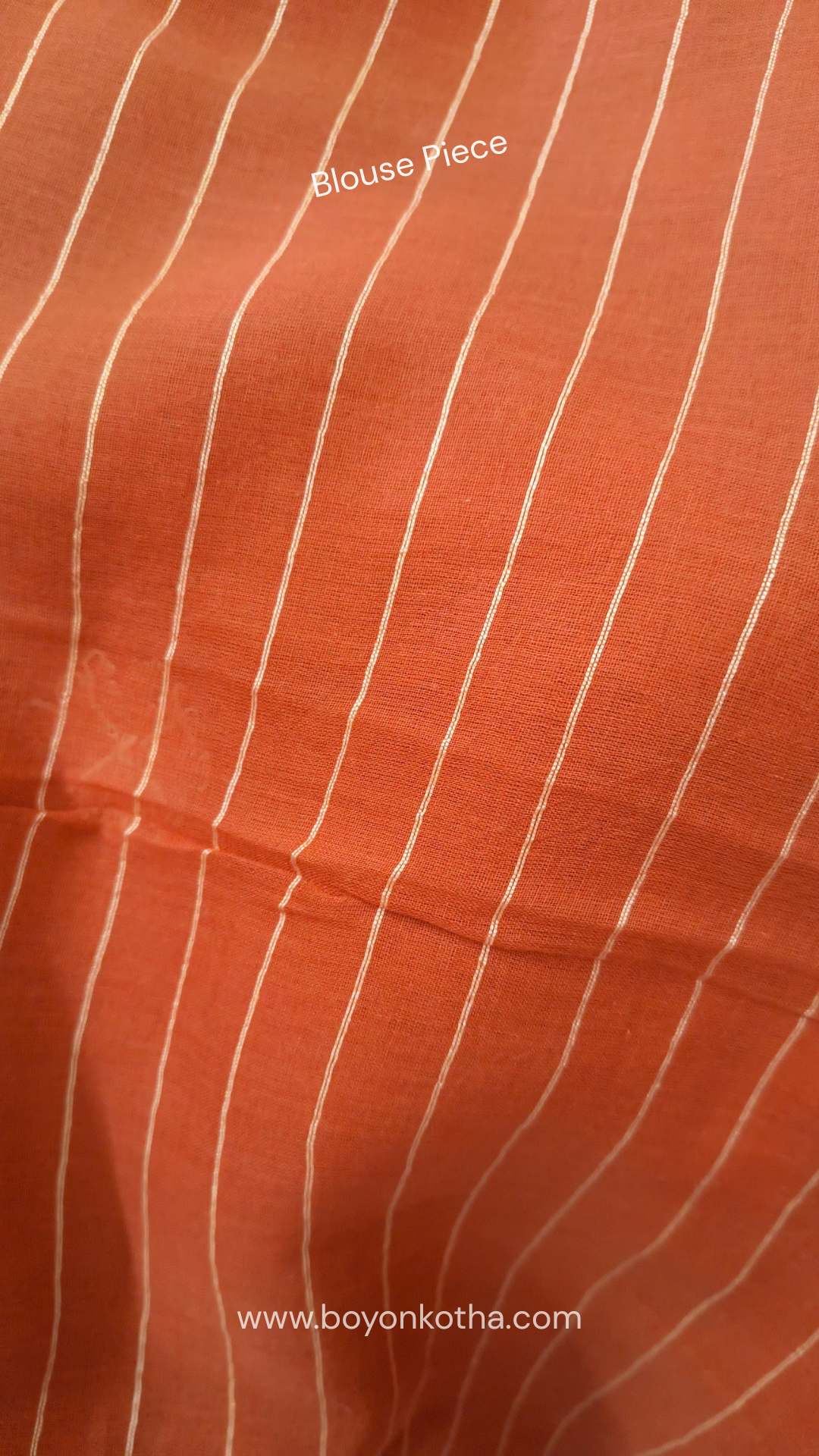 Orangish peach buttery soft handloom cotton saree, with jamdani inspired handloom jacquard woven butas all over and braided tassels. Ideal for festive mornings