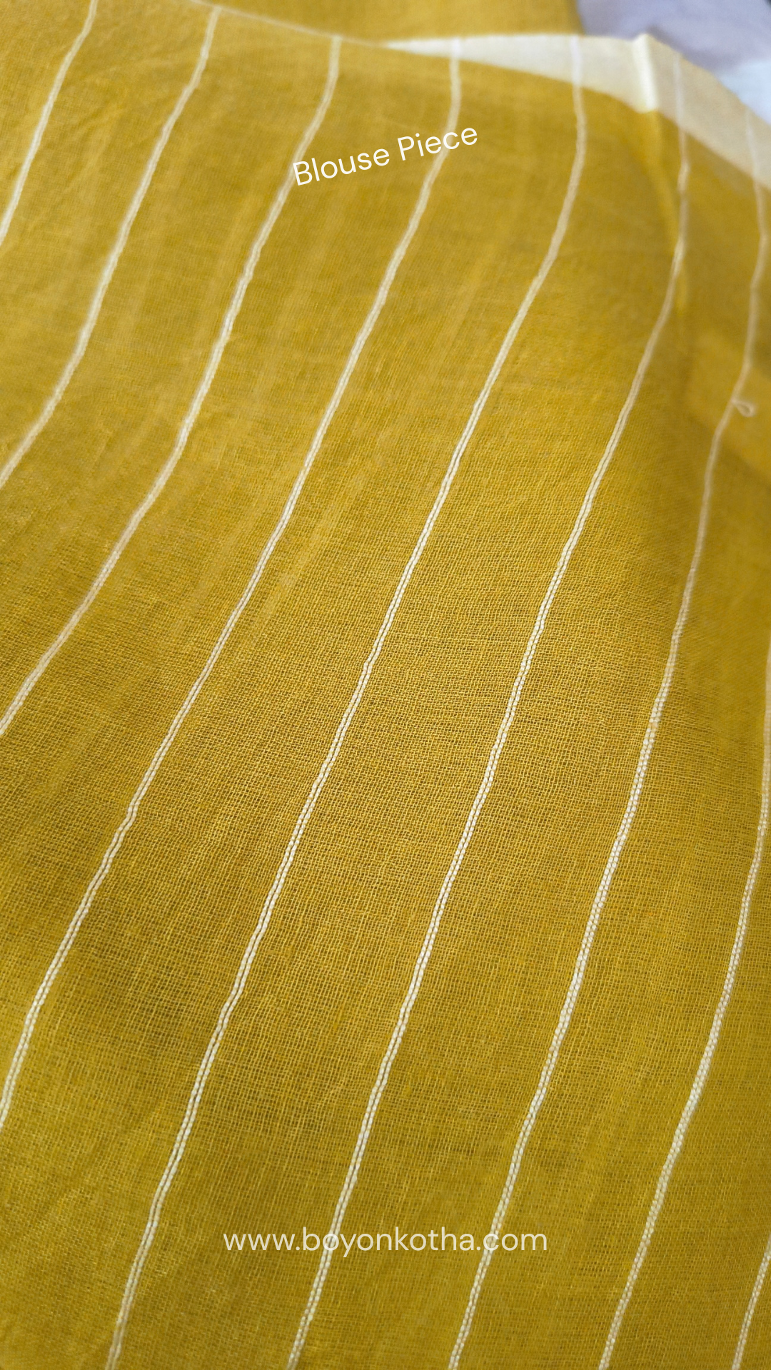 Greenish yellow buttery soft handloom cotton saree, with jamdani inspired handloom jacquard woven butas all over and braided tassels. Ideal for festive mornings