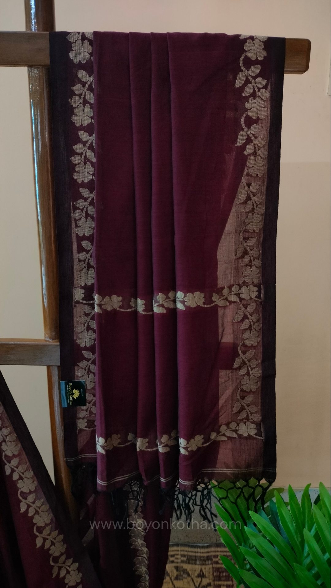 Handloom cotton saree, maroon color with beige floral vines in the border and pallu