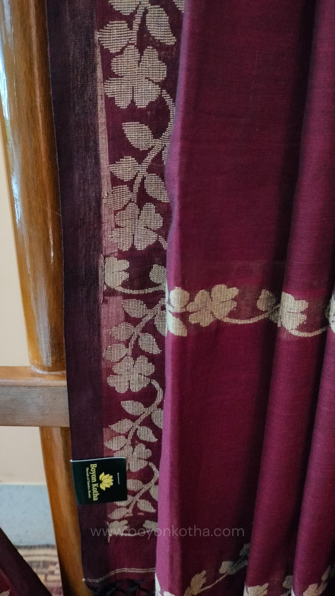 Handloom cotton saree, maroon color with beige floral vines in the border and pallu