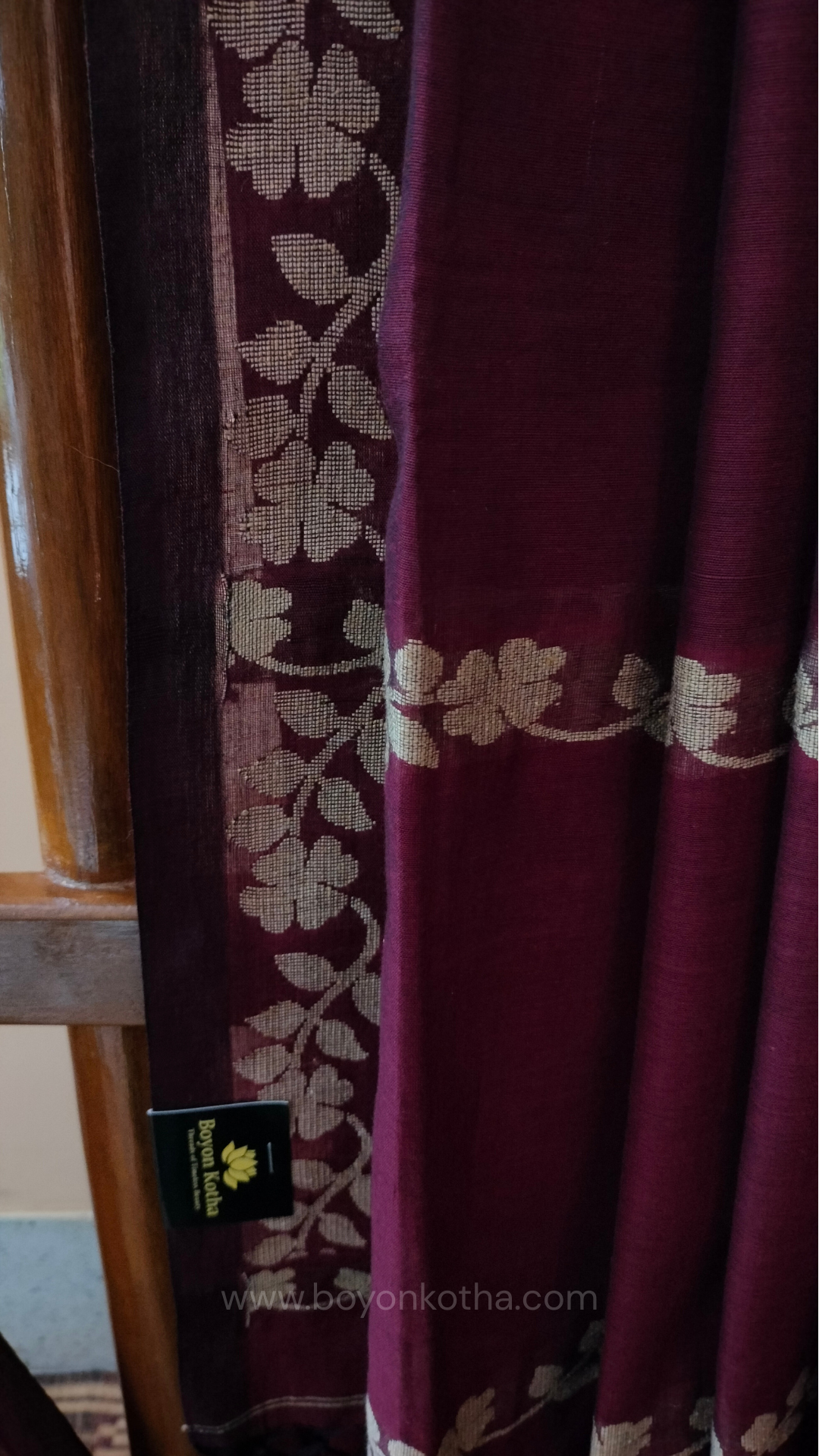 Handloom cotton saree, maroon color with beige floral vines in the border and pallu