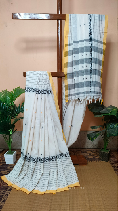 White Dhonekhali handloom cotton saree featuring a delicate yellow border and intricate woven black and yellow motifs. 
