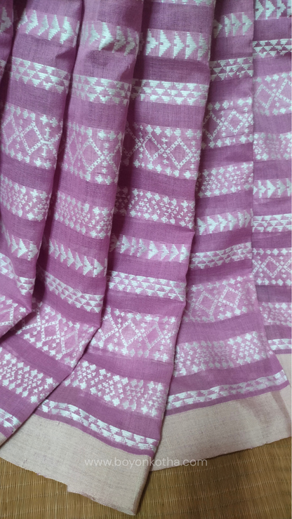 Pink Dhonekhali cotton saree adorned with delicate off-white woven patterns across the saree. Perfect for morning pujas to evening celebrations, for festive occasions