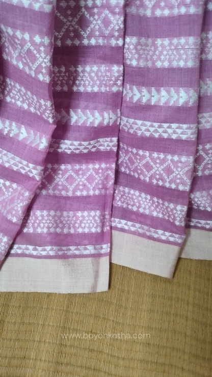 Pink Dhonekhali cotton saree adorned with delicate off-white woven patterns across the saree. Perfect for morning pujas to evening celebrations, for festive occasions