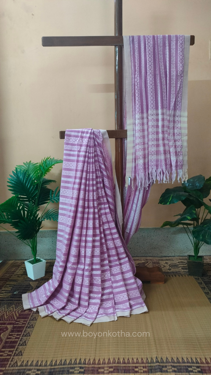 Pink Dhonekhali cotton saree adorned with delicate off-white woven patterns across the saree. Perfect for morning pujas to evening celebrations, for festive occasions