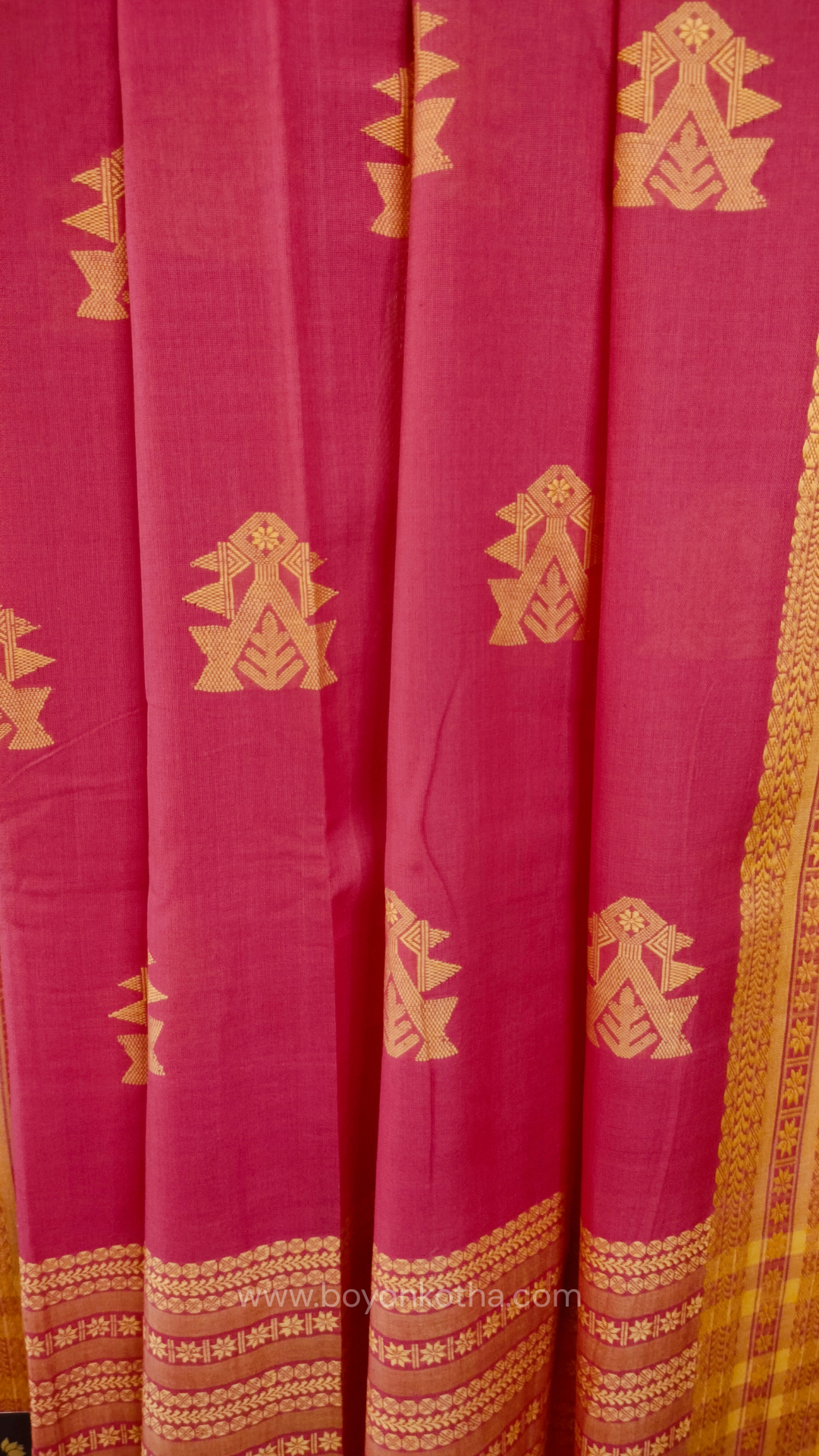 Pink handwoven mercerized cotton saree with Manipuri-inspired thread work pattern in yellow. Durable, breathable Bengal handloom saree for festive wear.