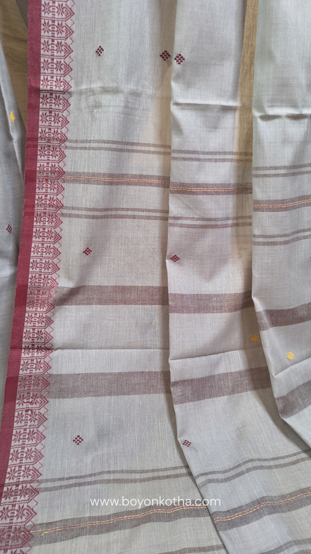 Light grey Dhonekhali handloom cotton saree with maroon and yellow dual border and butas in the saree, Ideal for office wear, casual gathering.
