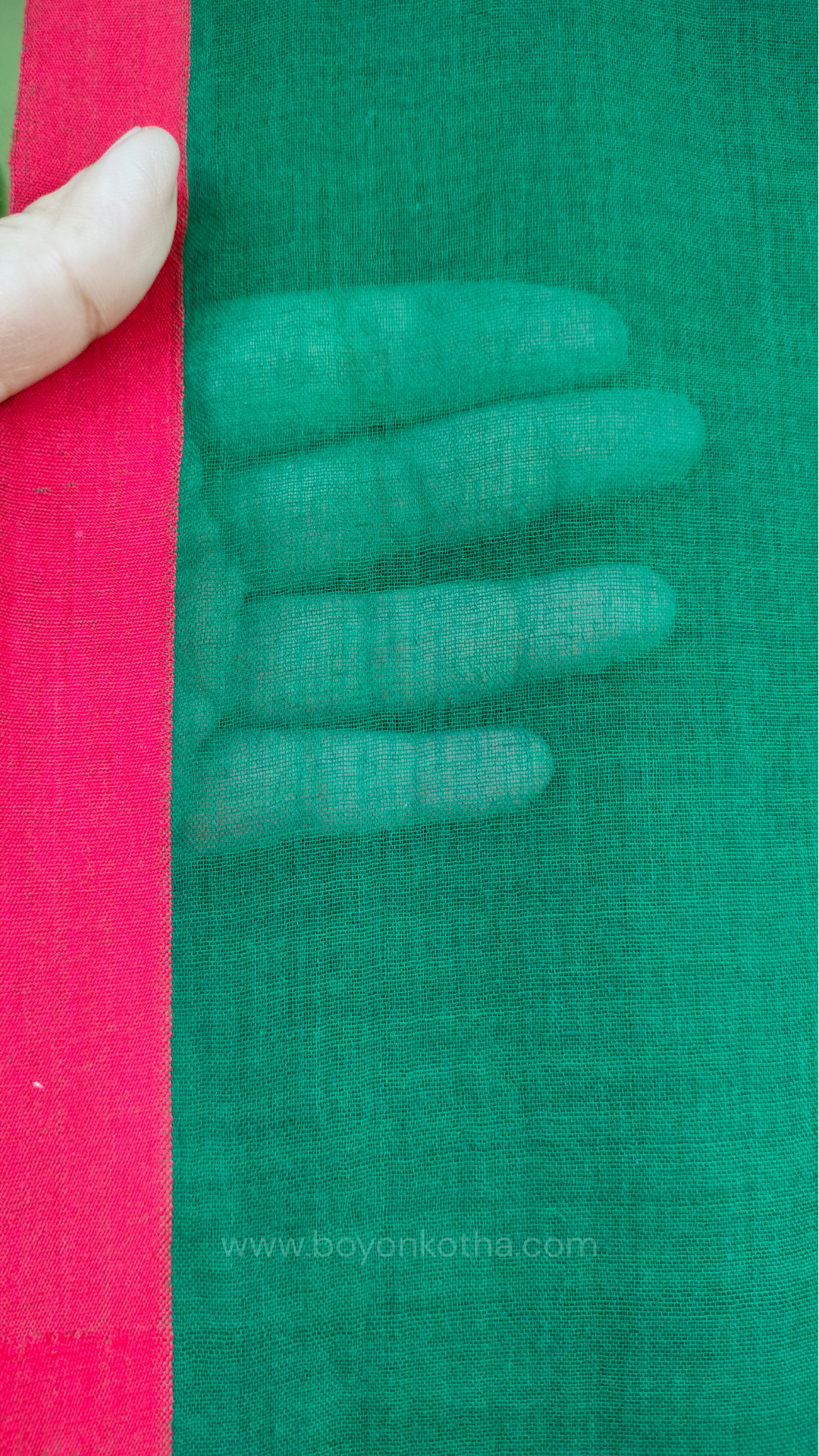 Bottle green handwoven mul cotton saree with red border, pallu ending in tassels. Plain handloom saree from Bengal.
