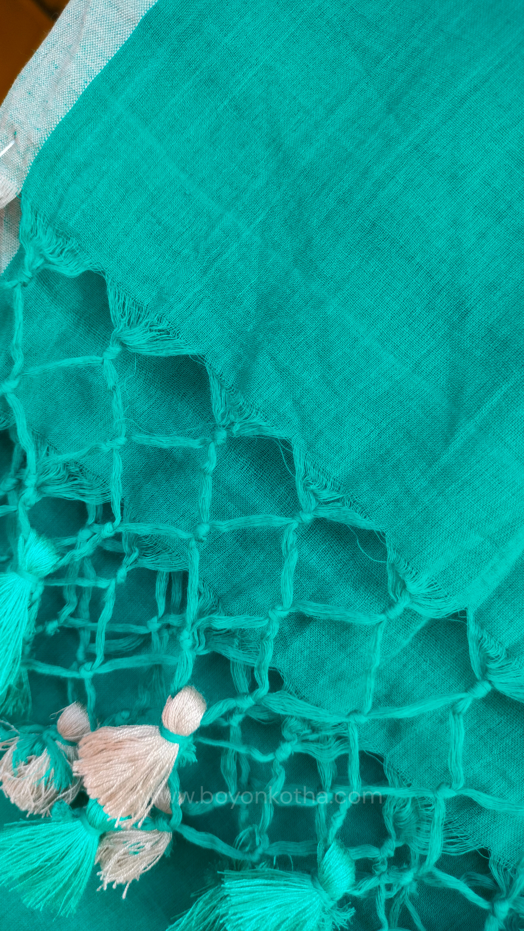 Turquoise blue  handwoven mul cotton saree with grey border, pallu ending in tassels. Plain handloom saree from Bengal.