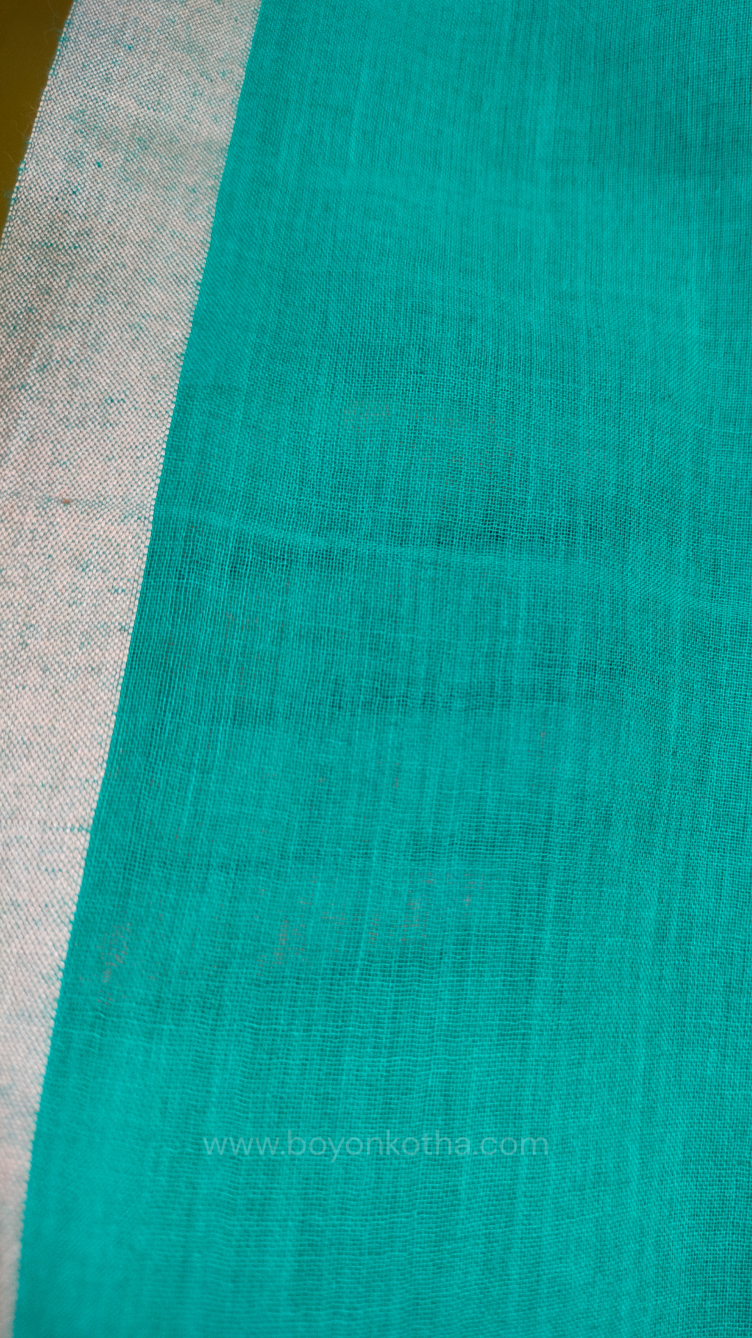 Turquoise blue  handwoven mul cotton saree with grey border, pallu ending in tassels. Plain handloom saree from Bengal.