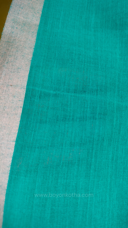 Turquoise blue  handwoven mul cotton saree with grey border, pallu ending in tassels. Plain handloom saree from Bengal.