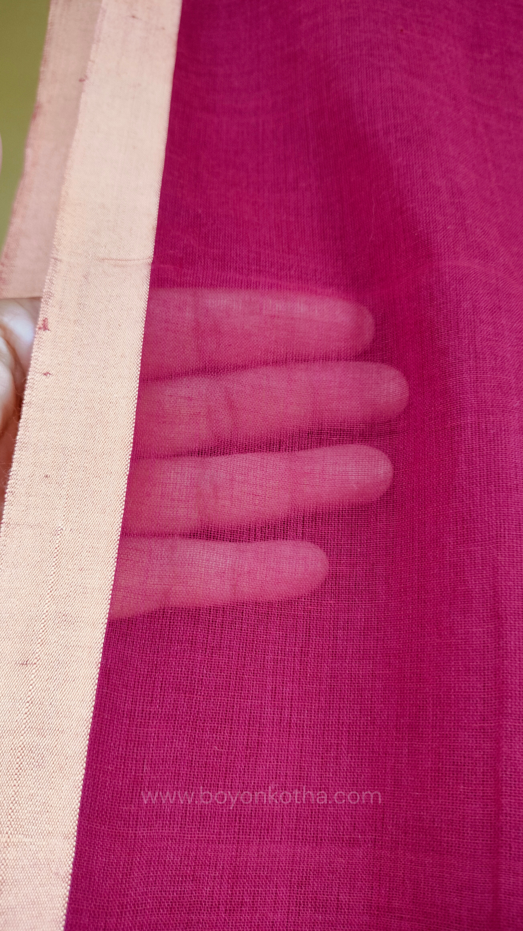 Maroon handwoven mul cotton saree with beige border, pallu ending in tassels. Plain handloom saree from Bengal.