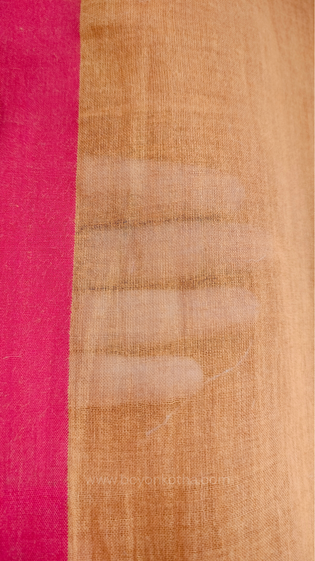 Mustard yellow handwoven mul cotton saree with red border, pallu ending in tassels. Plain handloom mustard yellow saree from Bengal.