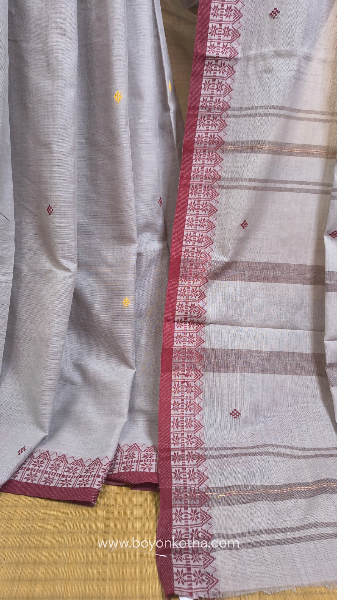 Light grey Dhonekhali handloom cotton saree with maroon and yellow dual border and butas in the saree, Ideal for office wear, casual gathering.