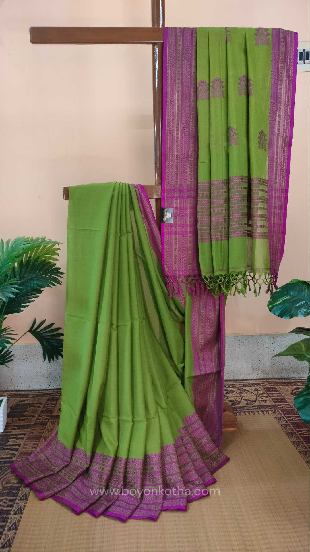 Parakeet Green handwoven mercerized cotton saree with Manipuri-inspired thread work pattern in pink. Durable, breathable Bengal handloom saree for festive wear.