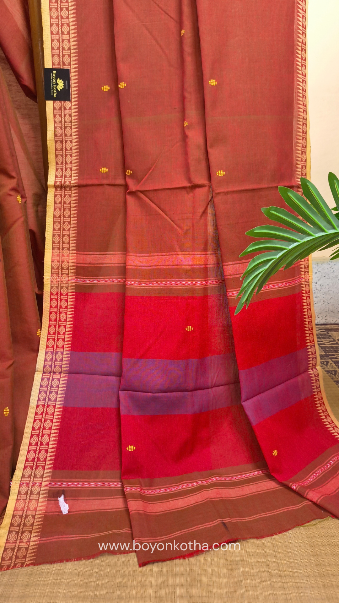 Rust Dhonekhali handloom cotton saree with red & blue stripes in the pallu and beige woven thin border; Ideal for office wear, casual gathering.