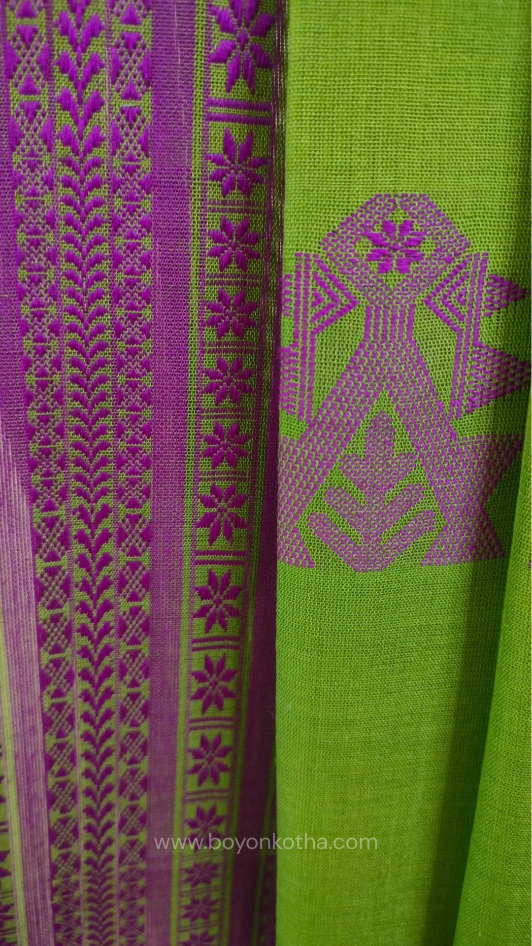 Parakeet Green handwoven mercerized cotton saree with Manipuri-inspired thread work pattern in pink. Durable, breathable Bengal handloom saree for festive wear.