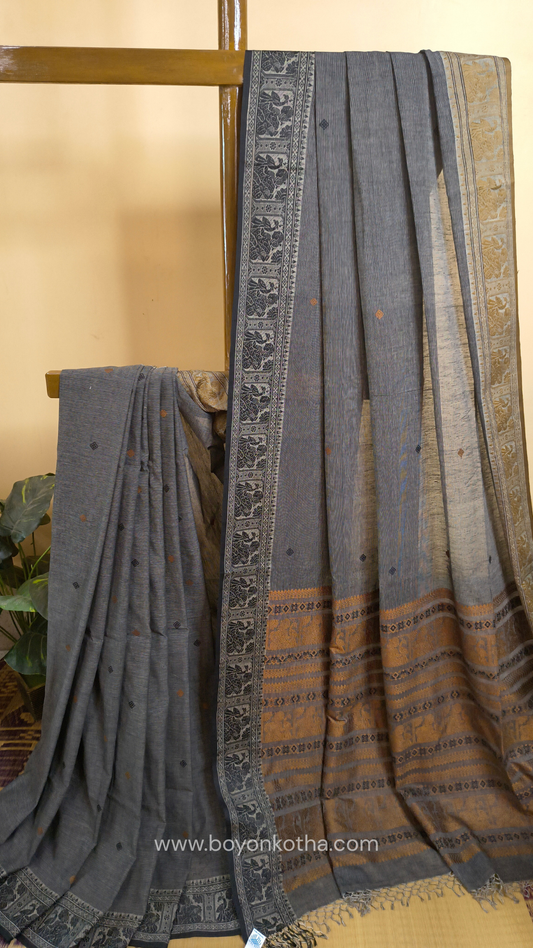 Grey cotton baluchari saree, with woven motifs in the border & pallu in black and copper. Bengal handloom ideal for festivals & everyday celebrations.
