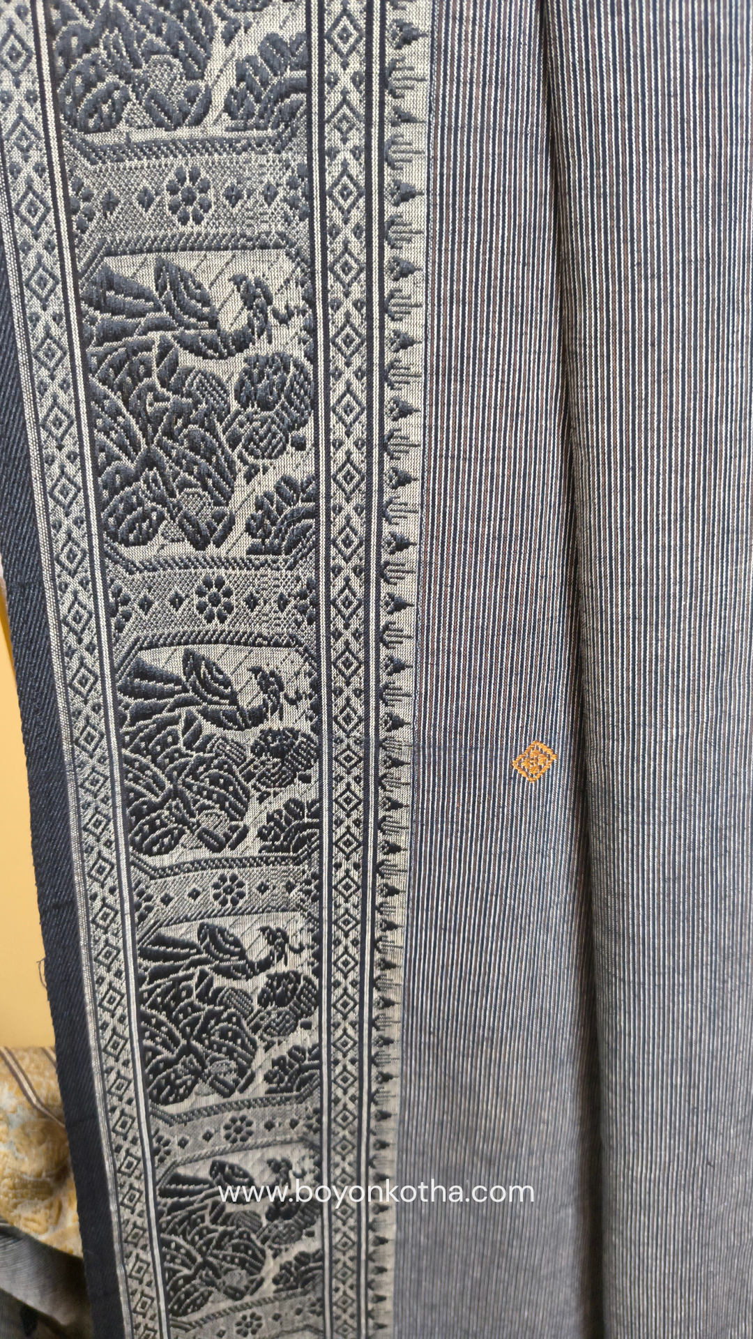 Grey cotton baluchari saree, with woven motifs in the border & pallu in black and copper. Bengal handloom ideal for festivals & everyday celebrations.