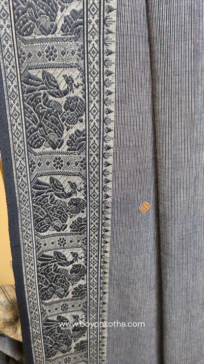 Grey cotton baluchari saree, with woven motifs in the border & pallu in black and copper. Bengal handloom ideal for festivals & everyday celebrations.