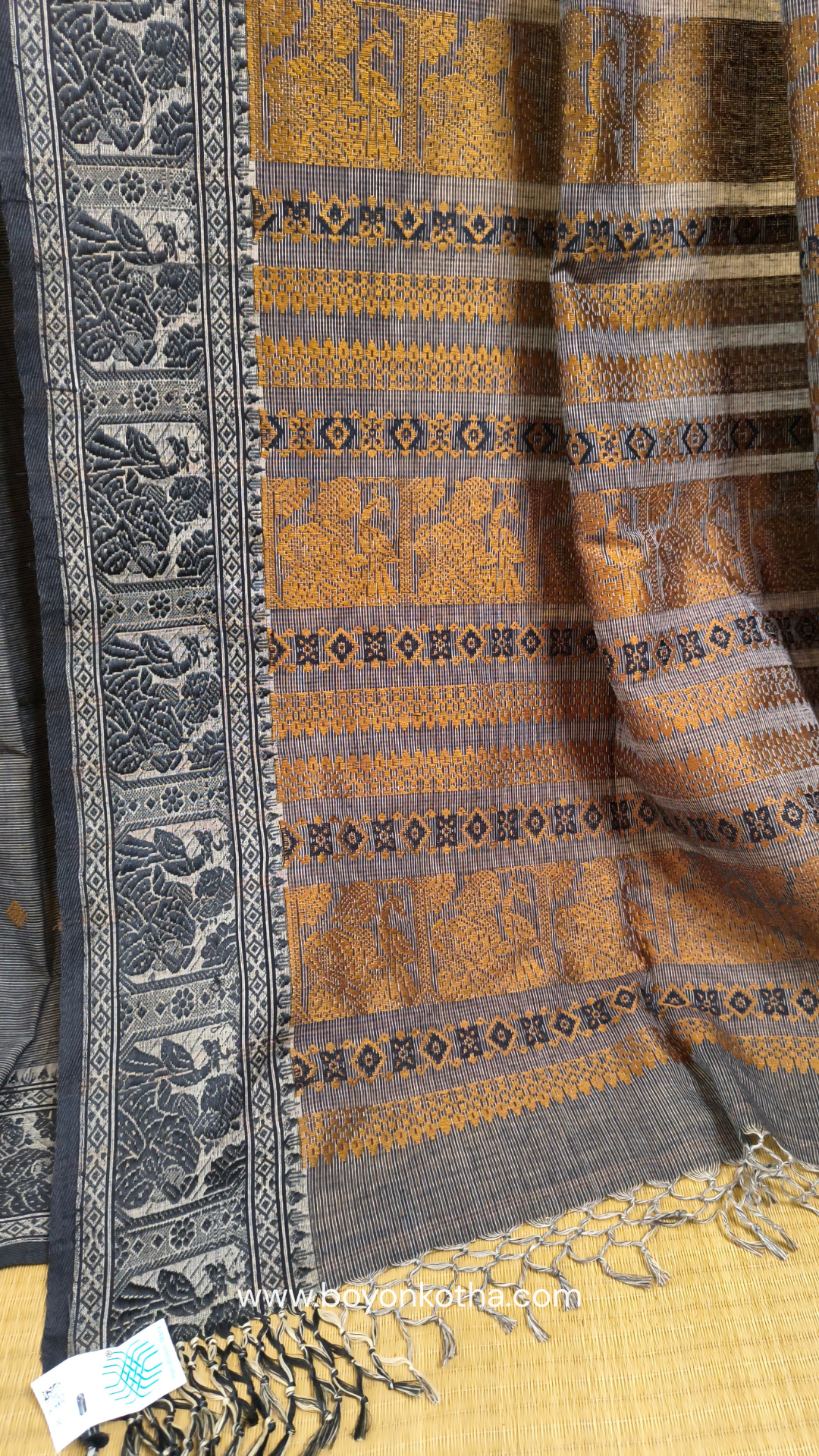 Grey cotton baluchari saree, with woven motifs in the border & pallu in black and copper. Bengal handloom ideal for festivals & everyday celebrations.