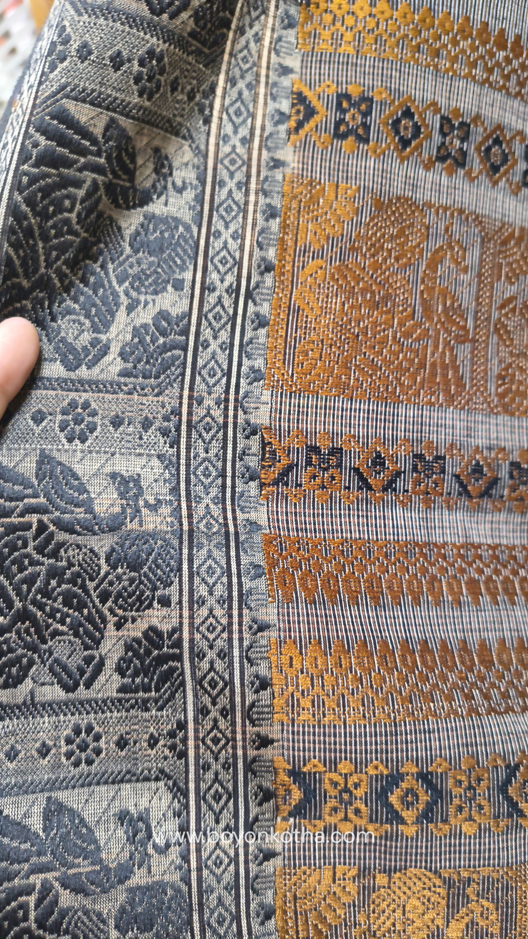 Grey cotton baluchari saree, with woven motifs in the border & pallu in black and copper. Bengal handloom ideal for festivals & everyday celebrations.