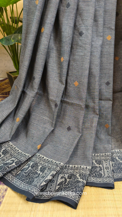 Grey cotton baluchari saree, with woven motifs in the border & pallu in black and copper. Bengal handloom ideal for festivals & everyday celebrations.
