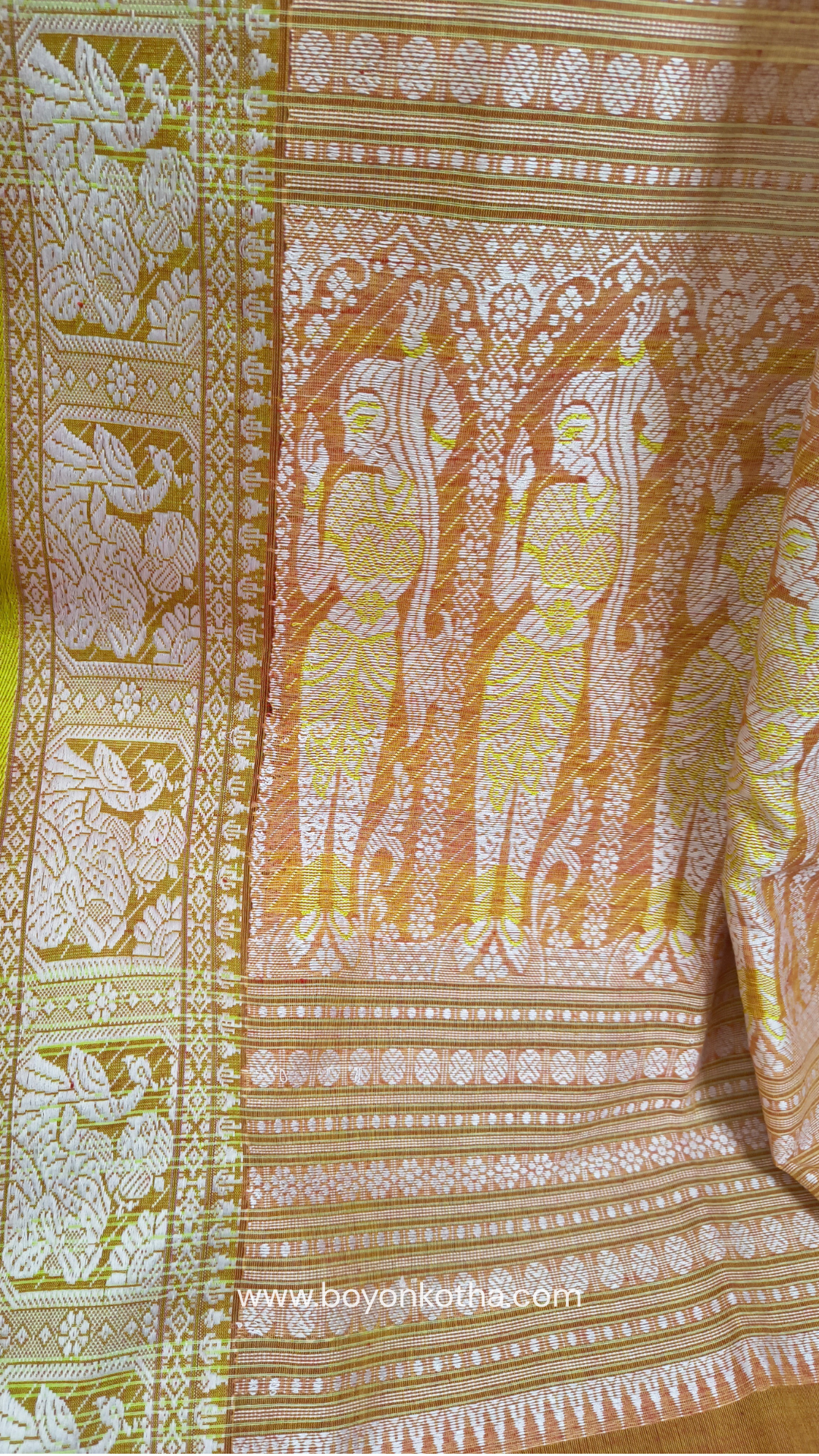Dark orange cotton baluchari saree, with woven motifs in the border & pallu in white and neon green. Bengal handloom ideal for festivals & everyday celebrations.