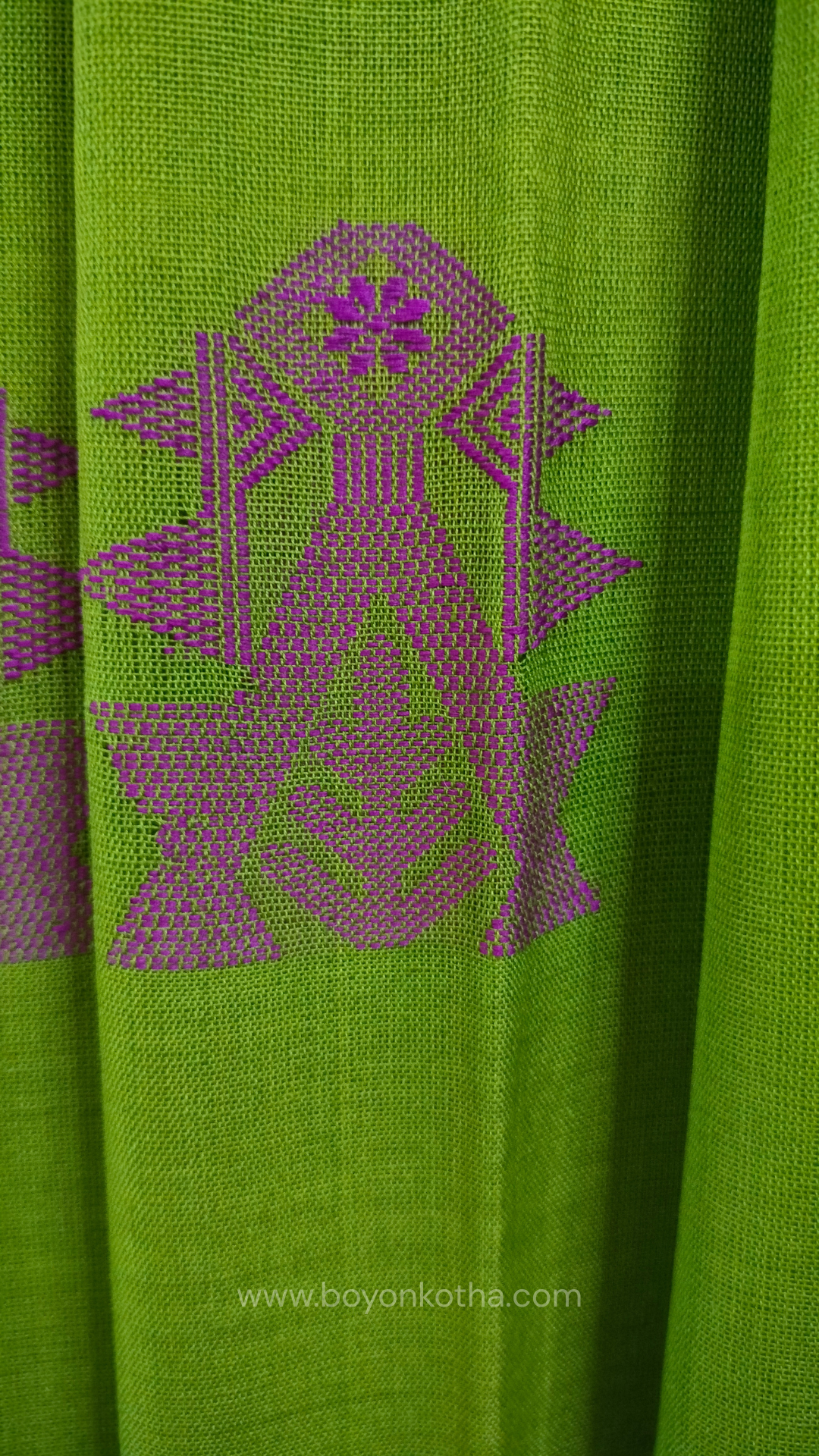 Parakeet Green handwoven mercerized cotton saree with Manipuri-inspired thread work pattern in pink. Durable, breathable Bengal handloom saree for festive wear.