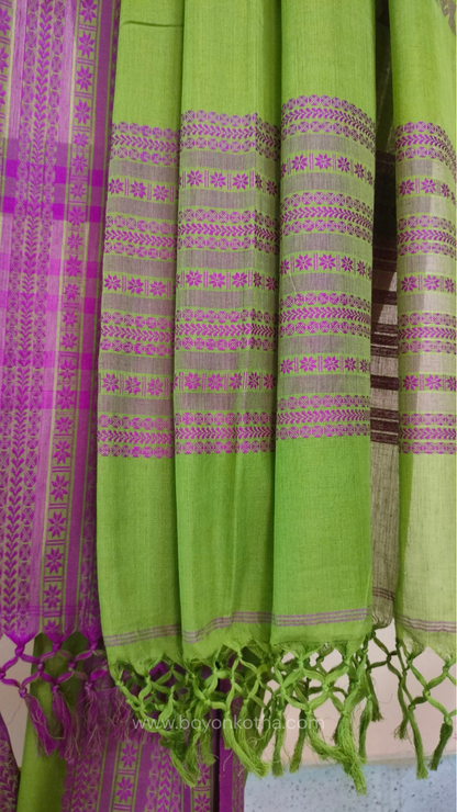 Parakeet Green handwoven mercerized cotton saree with Manipuri-inspired thread work pattern in pink. Durable, breathable Bengal handloom saree for festive wear.