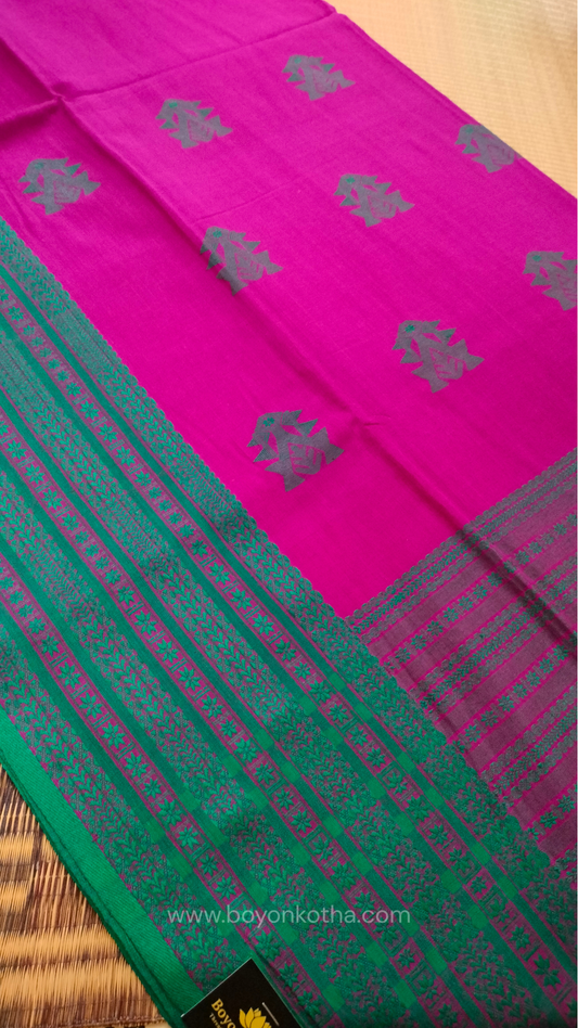 Magenta handwoven mercerized cotton saree with Manipuri-inspired thread work pattern in rama green. Durable, breathable Bengal handloom saree for festive wear.