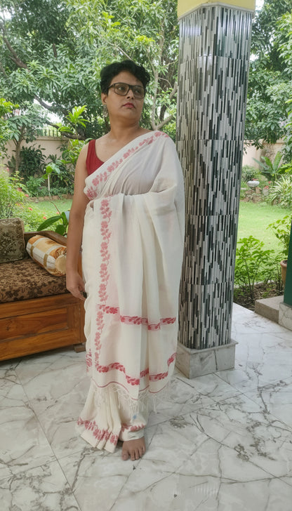 White handloom cotton saree with woven red floral vines along the border running till the pallu - Bengal handloom