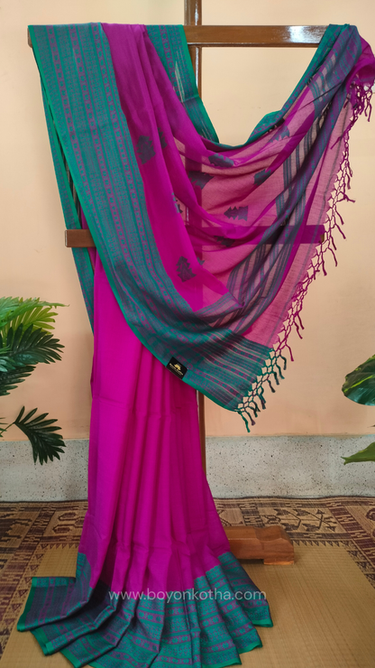 Magenta handwoven mercerized cotton saree with Manipuri-inspired thread work pattern in rama green. Durable, breathable Bengal handloom saree for festive wear.