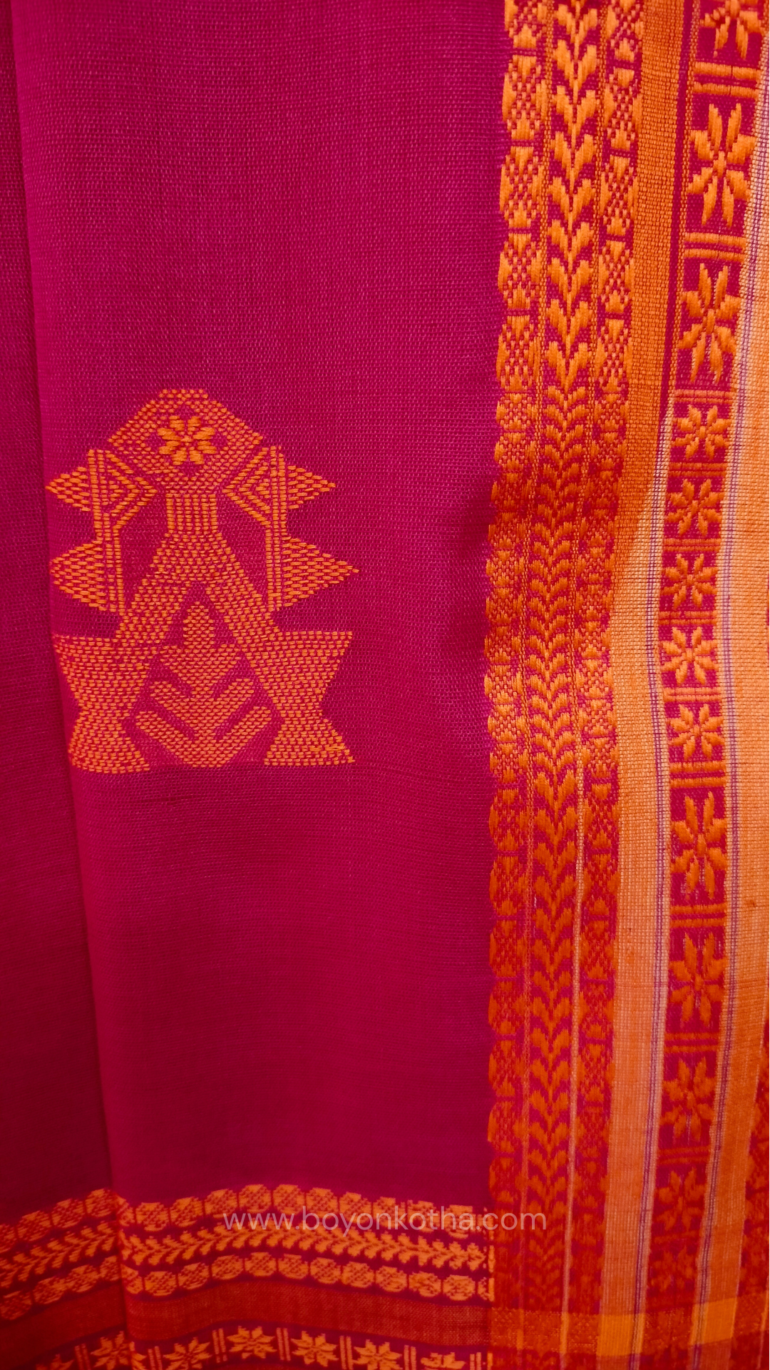 Rani Pink handwoven mercerized cotton saree with Manipuri-inspired thread work pattern in orange. Durable, breathable Bengal handloom saree for festive wear.