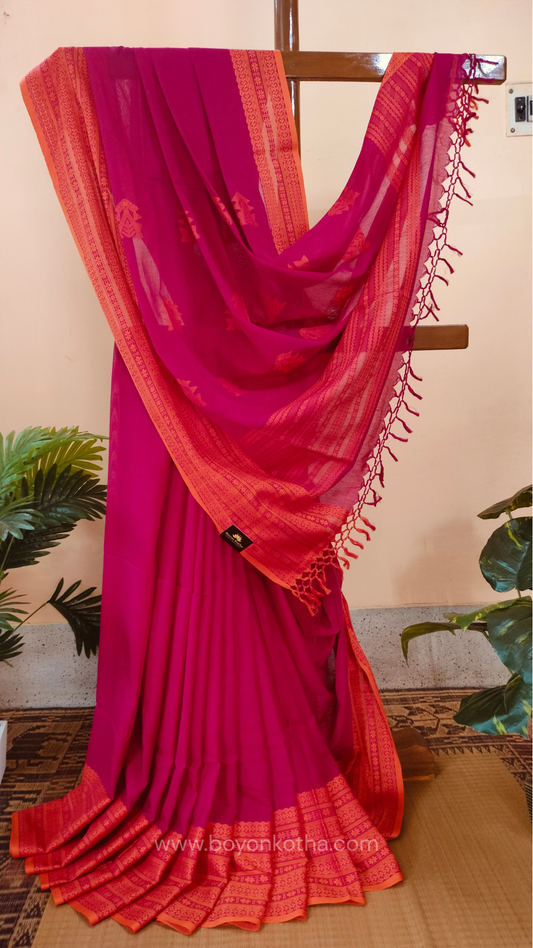 Rani Pink handwoven mercerized cotton saree with Manipuri-inspired thread work pattern in orange. Durable, breathable Bengal handloom saree for festive wear.