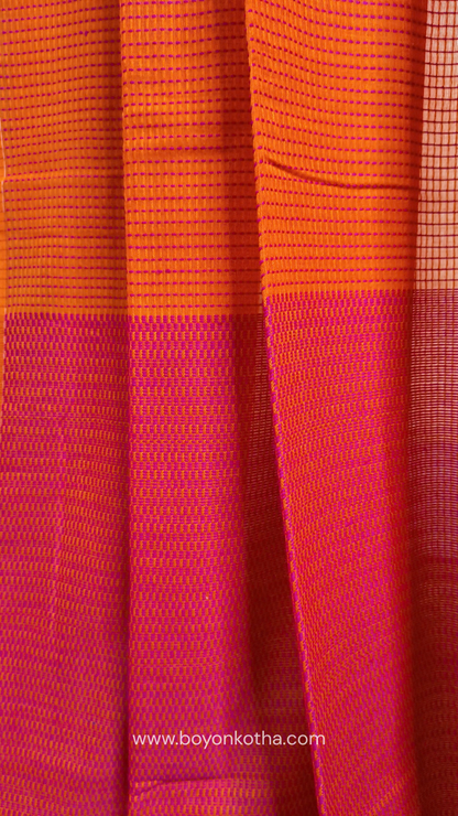 Orange handloom cotton saree with a kantha inspired weave in rani pink throughout, finished with tassels in the palla. Ideal for festivals & cultural gatherings