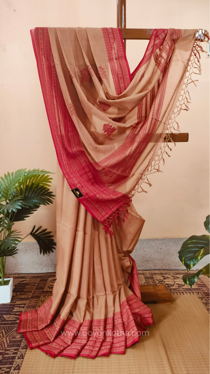 Beige handwoven mercerized cotton saree with Manipuri-inspired thread work pattern in red. Durable, breathable Bengal handloom saree for festive wear.