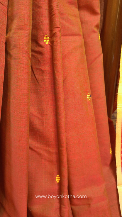Rust Dhonekhali handloom cotton saree with red & blue stripes in the pallu and beige woven thin border; Ideal for office wear, casual gathering.