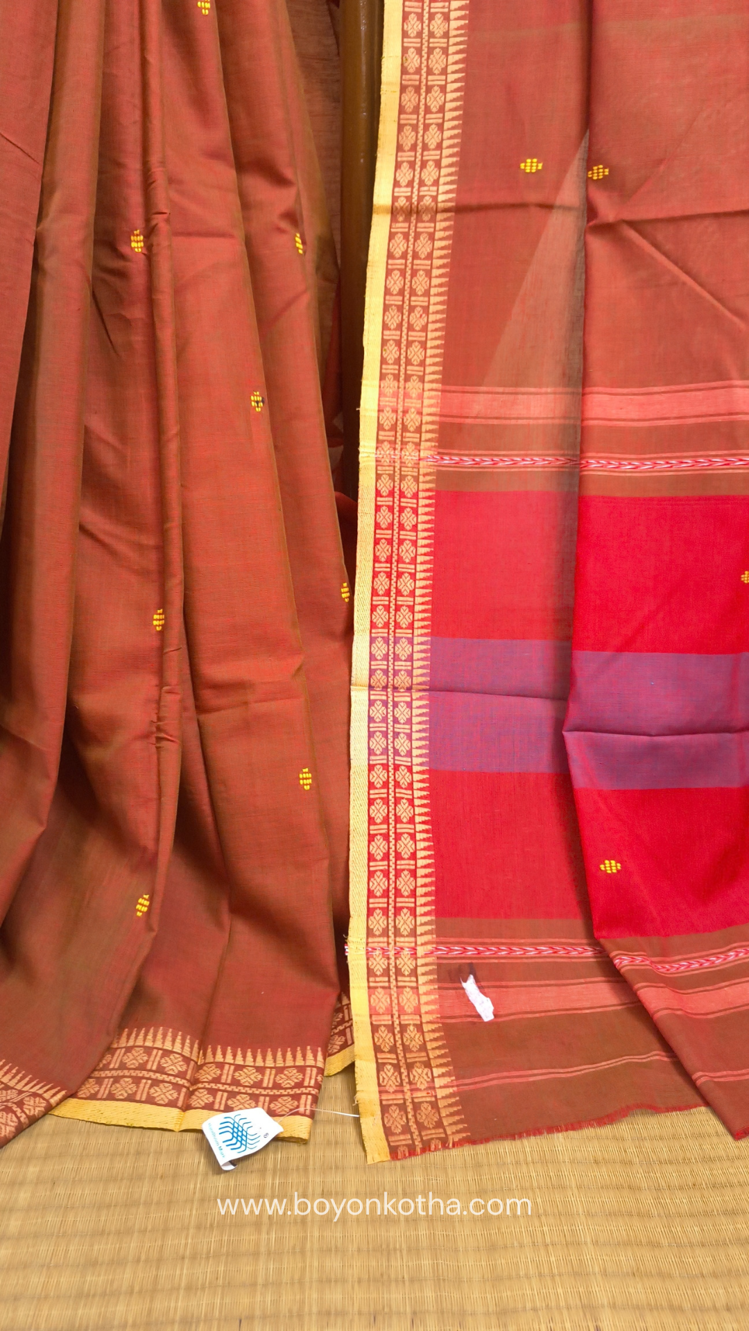 Rust Dhonekhali handloom cotton saree with red & blue stripes in the pallu and beige woven thin border; Ideal for office wear, casual gathering.