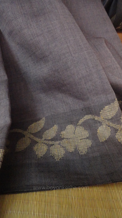 Steel gray handloom cotton saree with woven beige floral vines running on both sides of the border till he pallu, bengal handloom, gray cotton saree