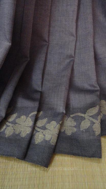 Steel gray handloom cotton saree with woven beige floral vines running on both sides of the border till he pallu, bengal handloom, gray cotton saree