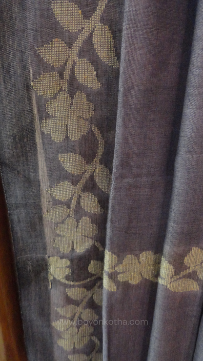 Steel gray handloom cotton saree with woven beige floral vines running on both sides of the border till he pallu, bengal handloom, gray cotton saree
