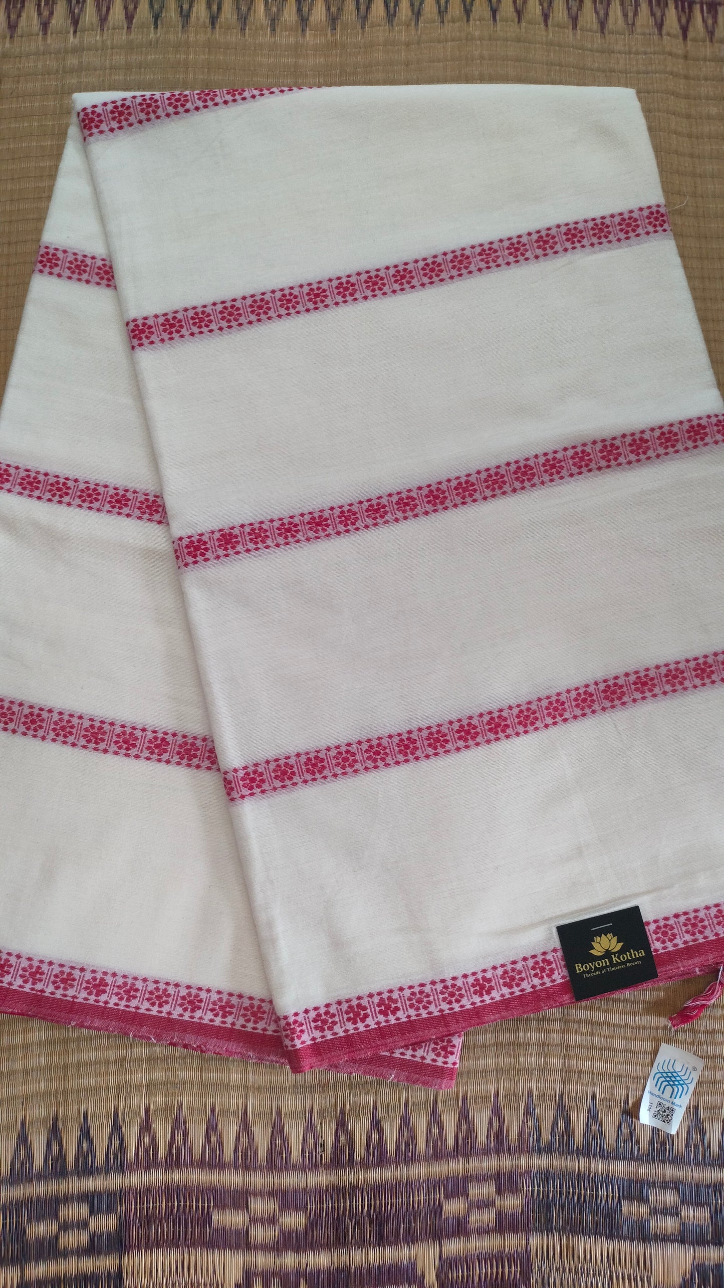 Red and white cotton saree. Lightweight, breathable handloom cotton saree, with multiple woven motifs bands running horizontally across the body till the pallu. Perfect for casual everyday wear and festive occasion.