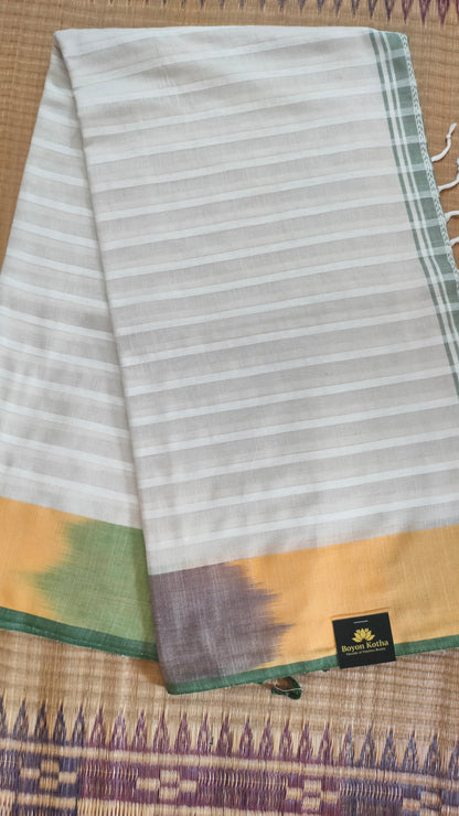 Dhonekhali handloom cotton saree with a striped body in alternating off-white and cream tones, complemented by a vibrant multi-hued border in green, purple, and yellow abstract patterns. Finished with tassel details at the pallu.
