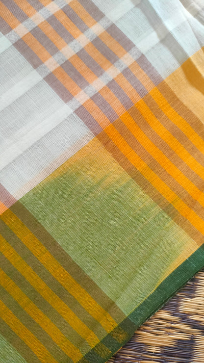 Dhonekhali handloom cotton saree with a striped body in alternating off-white and cream tones, complemented by a vibrant multi-hued border in green, purple, and yellow abstract patterns. Finished with tassel details at the pallu.