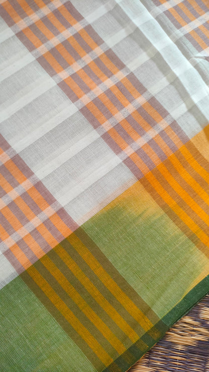 Dhonekhali handloom cotton saree with a striped body in alternating off-white and cream tones, complemented by a vibrant multi-hued border in green, purple, and yellow abstract patterns. Finished with tassel details at the pallu.