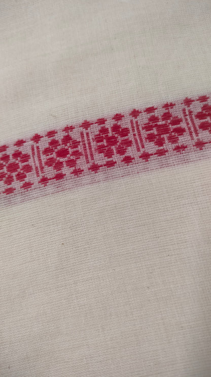 Red and white cotton saree. Lightweight, breathable handloom cotton saree, with multiple woven motifs bands running horizontally across the body till the pallu. Perfect for casual everyday wear and festive occasion.