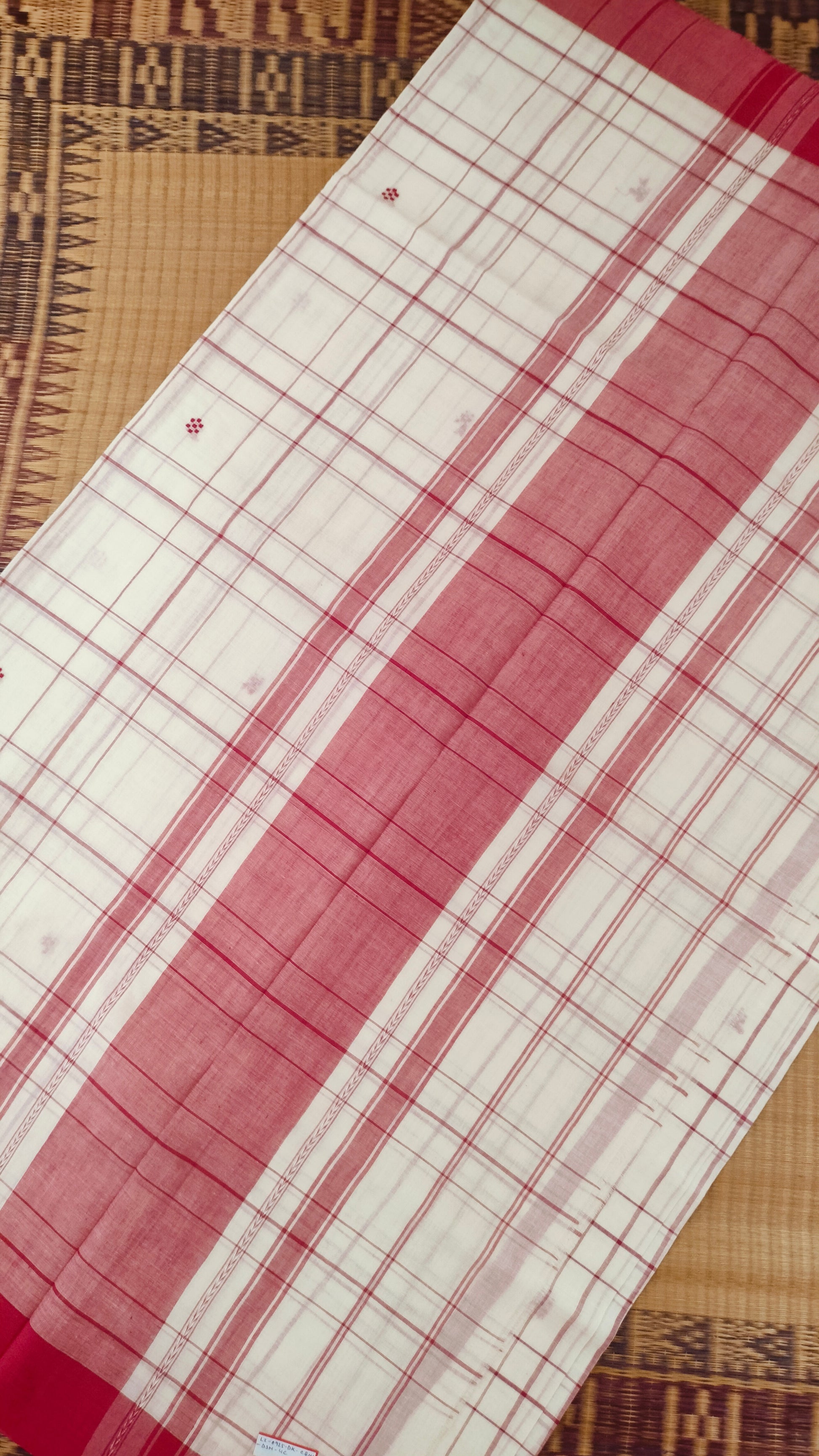 Red and white handloom cotton saree with woven checks and motifs. Dhonekhali cotton from Bengal handloom. 