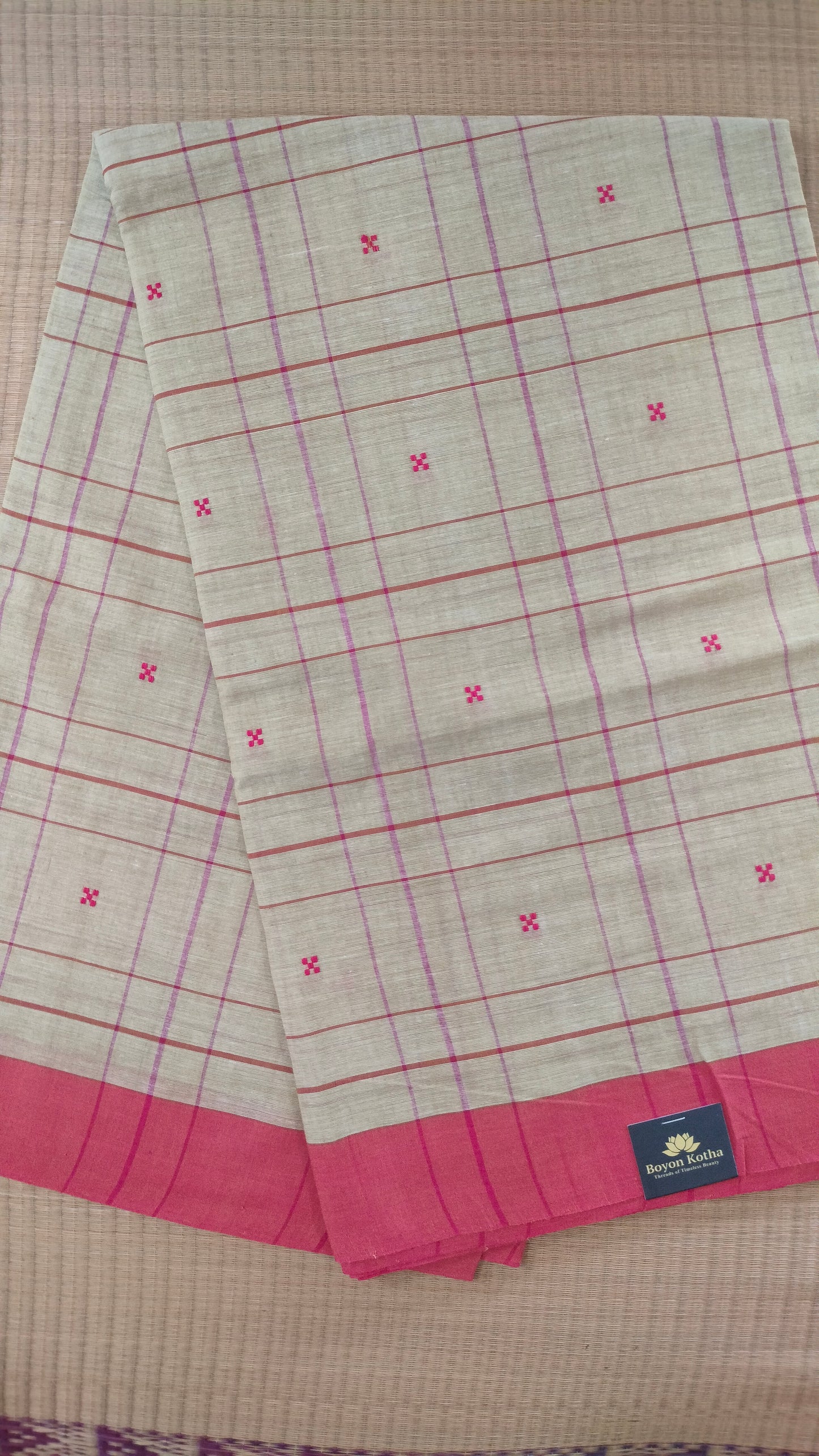 Beige and red Dhonekhali handloom cotton saree with woven red stripes and motifs throughout the saree. Bengal handloom cotton.